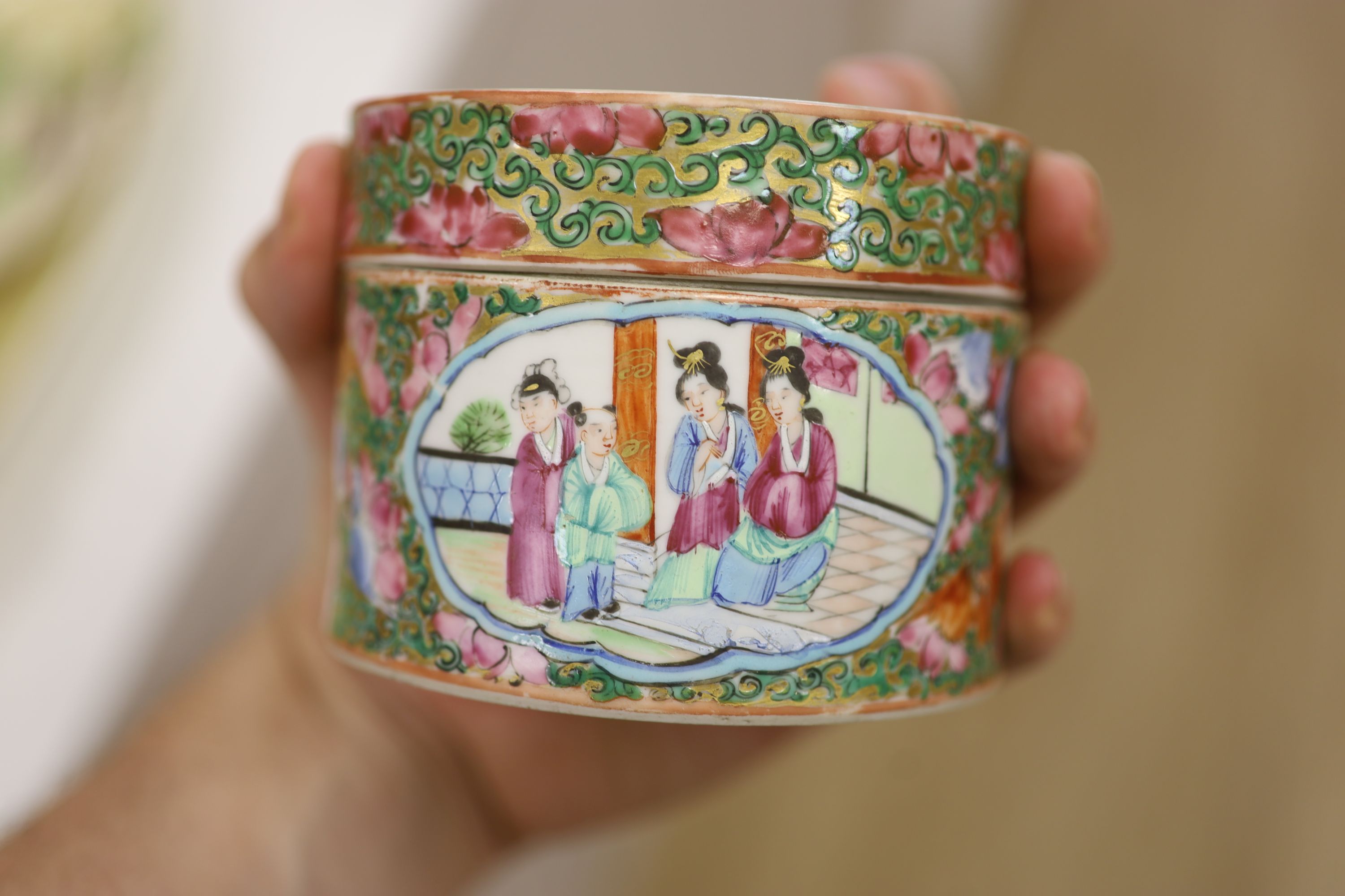A Chinese famille rose box and cover, two vases, a sugar bowl and cover and a saucer, late 19th/early 20th century, tallest 19cm